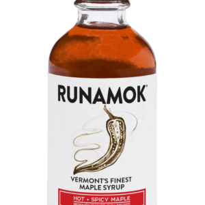 A bottle of maple syrup with the label runamok.