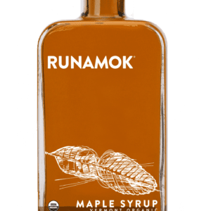 A bottle of maple syrup with a leaf design.