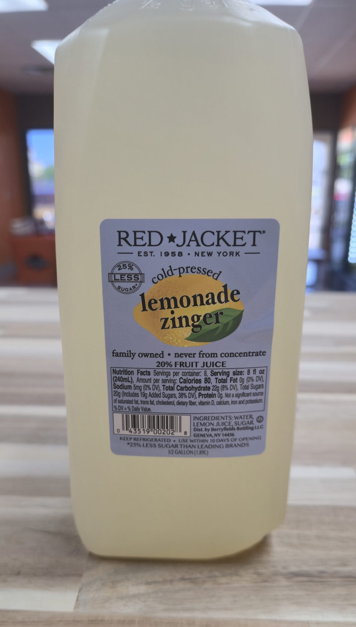 Lemonade Zinger juice bottle on table.